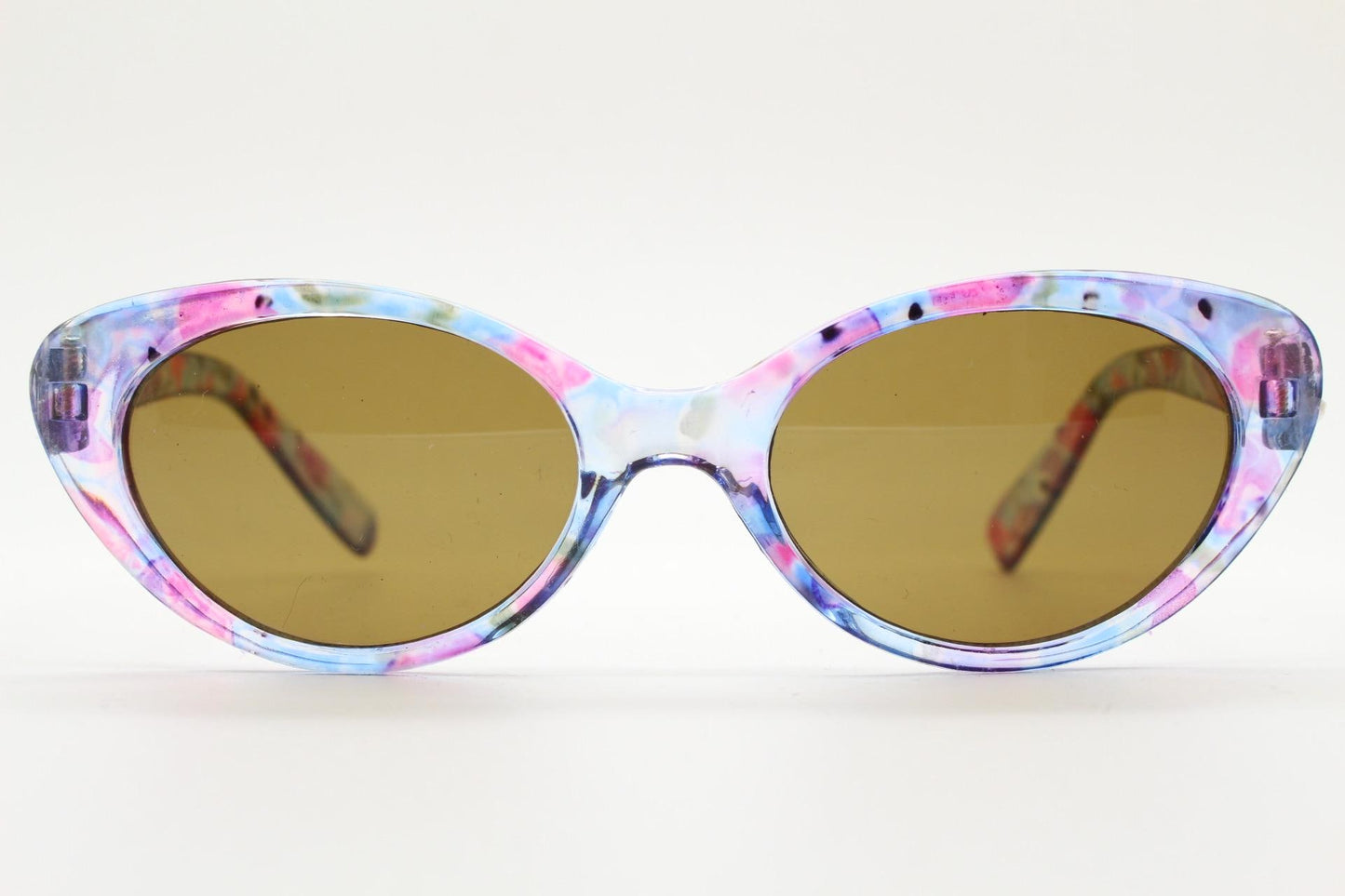 90s vintage oval cat eye sunglasses. Vibrant transparent multi coloured frame with mid tone brown lenses. 80s. NOS. BNWT
