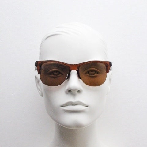 90s vintage modified wayfarer design sunglasses. Transparent brown browline half frame with brown or green interchangeable lenses . NOS