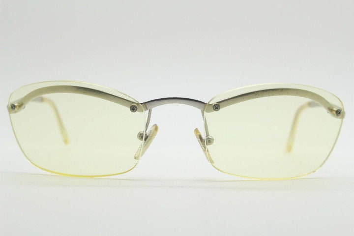Y2K vintage half frame extra light tone yellow sunglasses with satin alloy brow line. Minimalistic 2000's wrap around design. 00's NOS
