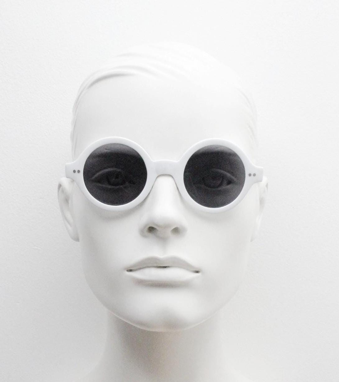 90s vintage round monochrome sunglasses. 30s design in an ice white frame with plain black lenses. Quality construction unused NOS