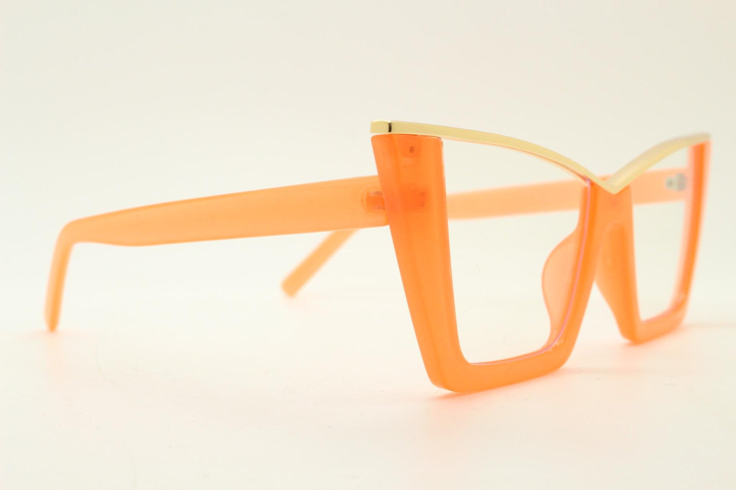 Dynamic pointed cat eye glasses. Transparent thick orange optical frame with gold metal 'owl' brow. and clear lenses. Vintage. Prescription