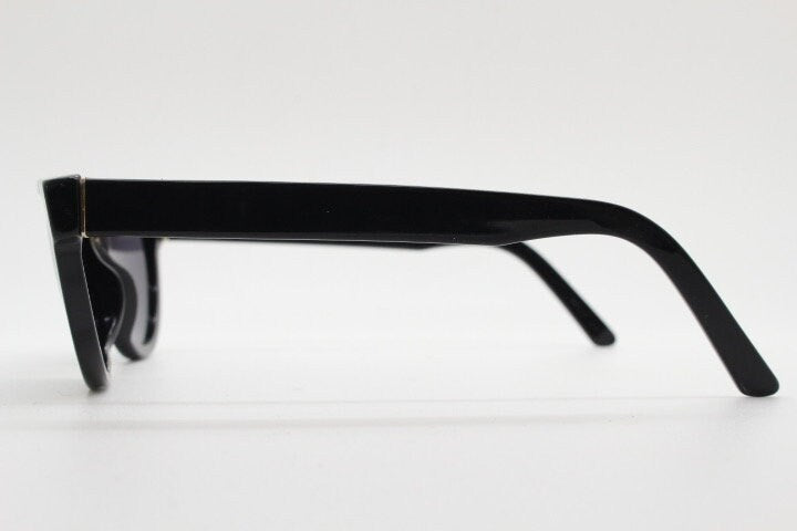 Retrosuperfuture thick flat top cat eye sunglasses hand made in Italy. All black gloss acetate frame. Vintage