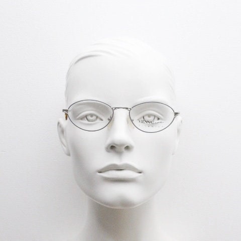 Viennaline 90s vintage oval eye glasses made in italy from titanium. Satin silver optical frame with grey enamel outline. Prescription RX
