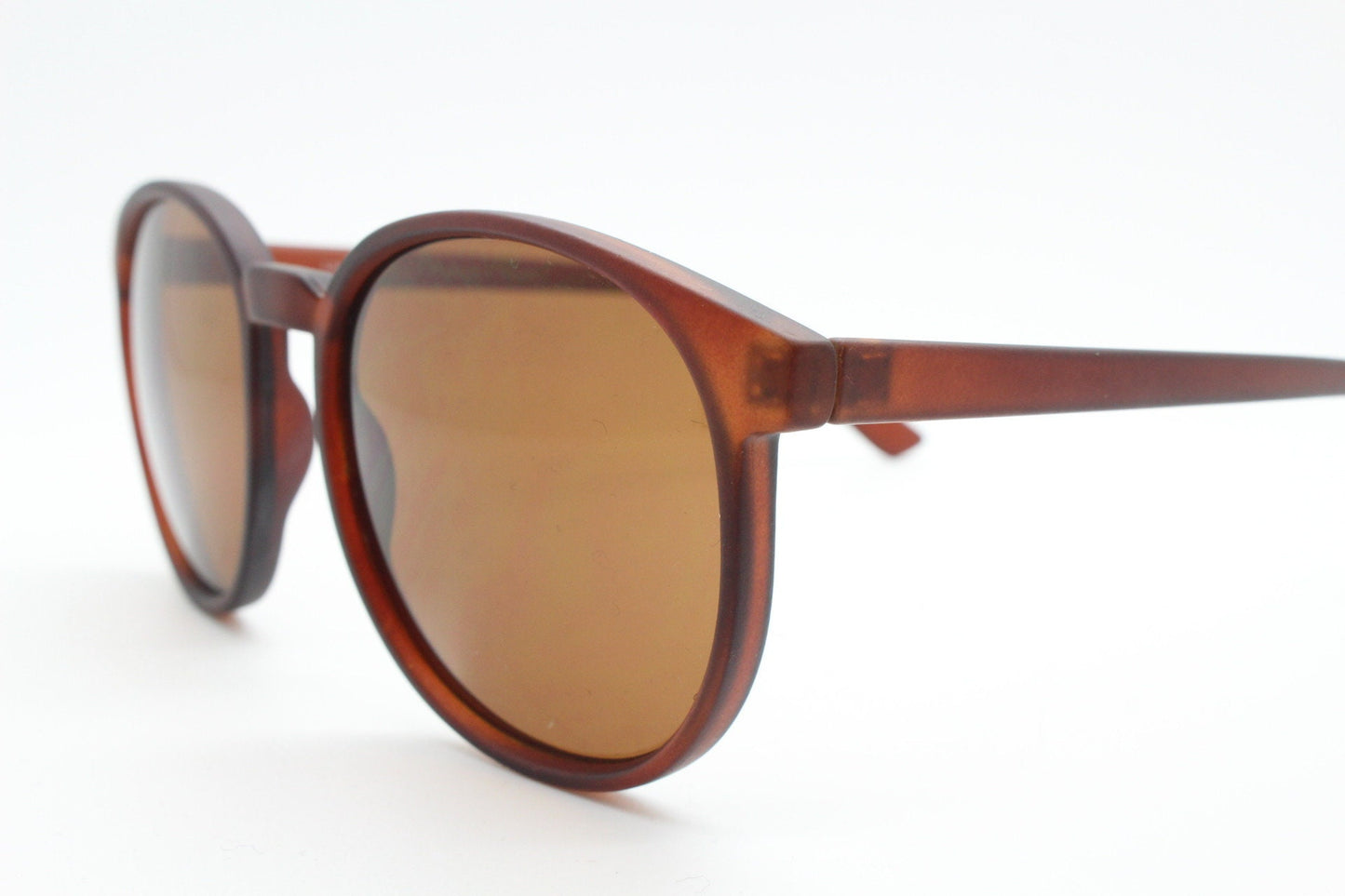 80s vintage round sunglasses. Slightly oversized slim transparent brown frame in a rubber finish with matching lenses. BNWT