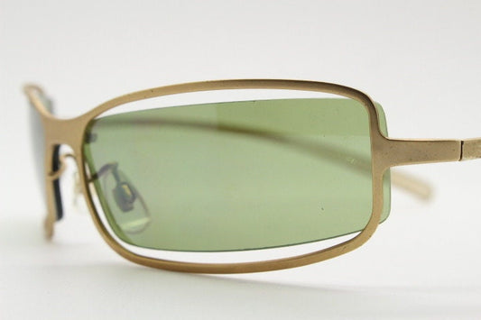 Y2K vintage wraparound sunglasses. Low profile satin finish golden slender frame with green lenses and gap feature. 2000's. 90s. NOS