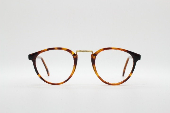 90s vintage round eye glasses. Minimal slim tortoise optical frames with gold bridge. 40s, 50s design prescription eyeglasses. RX spectacles