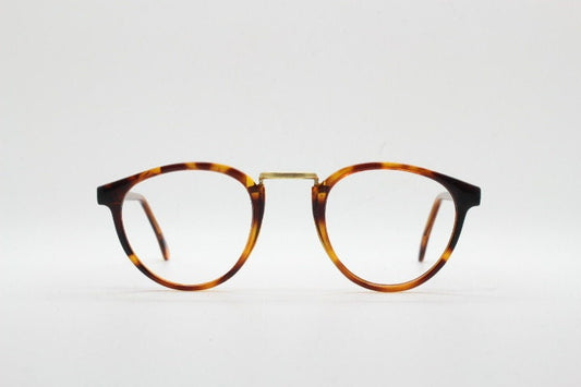 90s vintage round eye glasses. Minimal slim tortoise optical frames with gold bridge. 40s, 50s design prescription eyeglasses. RX spectacles