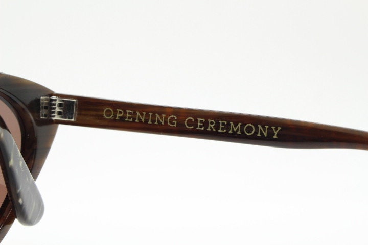 Opening Ceremony pointed cateye sunglasses. Womens classical cat eye marbled brown frame. Vintage. NOS. Y2K