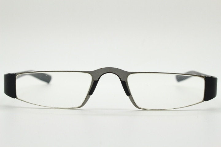 Porsche design rectangular eye glasses. Minimal grey metal optical frame in a matt finish with black arms. Vintage Prescription spectacles
