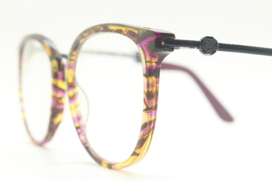 Kenzo vintage round eye glasses made in France. Tortoise with purple tones and matching arm sections. Womens Prescription Optical frames. RX