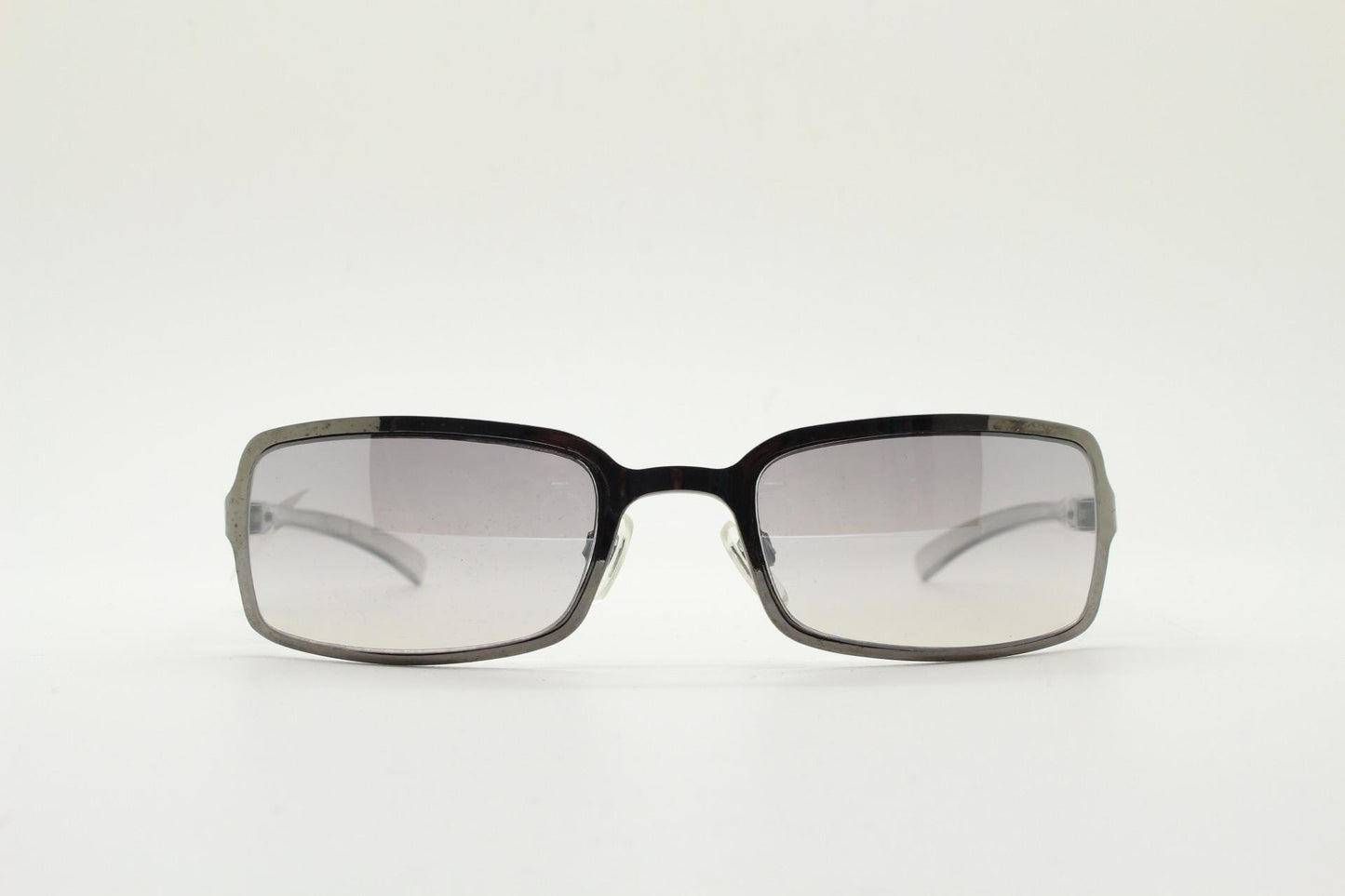 Y2K vintage rectangular sunglasses. Low profile mini shield frame in gunmetal chrome with light tone graduated mirror lens. 2000's. 90s. NOS