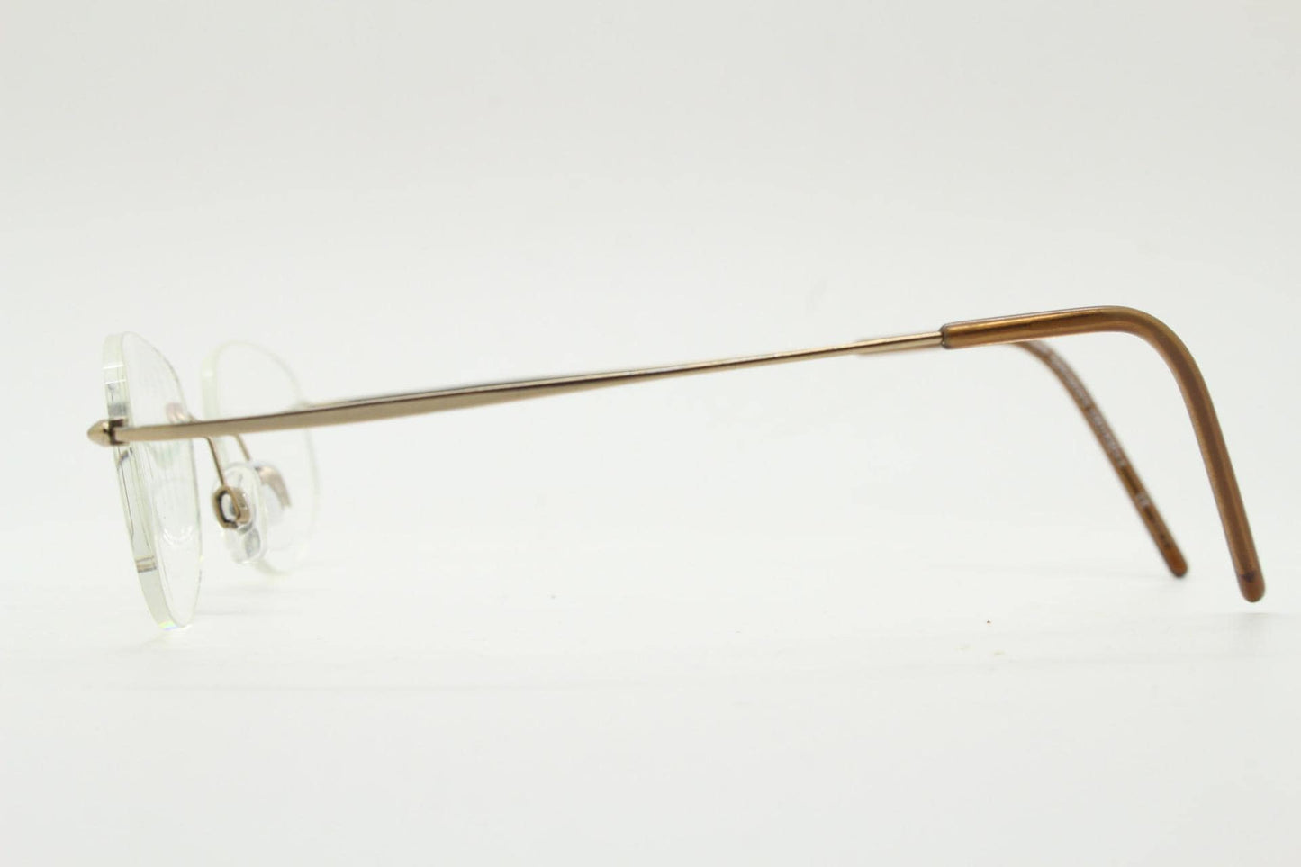 90s vintage angular oval frameless eye glasses. Minimal lightweight titanium optical frame. Flexible prescription RX spectacles