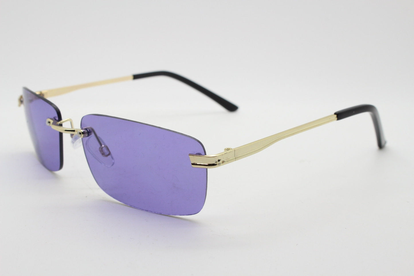 Y2K vintage frameless purple sunglasses. Rectangular lenses with gold bridge and arms. 2000s club kids. 00's. 90s Rave