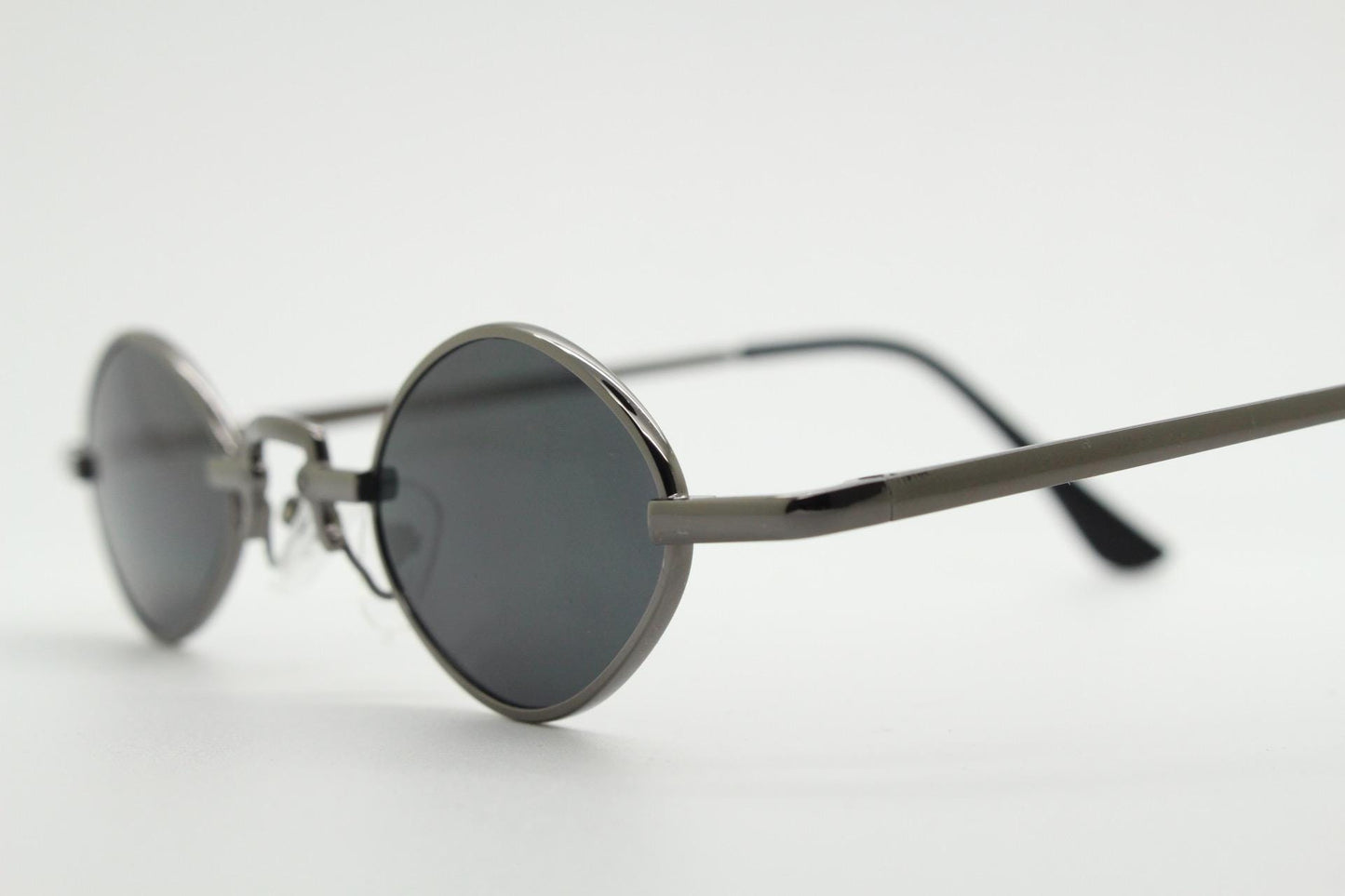 90s vintage small oval sunglasses. Imposing minimal gunmetal grey metal victorian style frame with black lenses. Steampunk. Unused BNWT