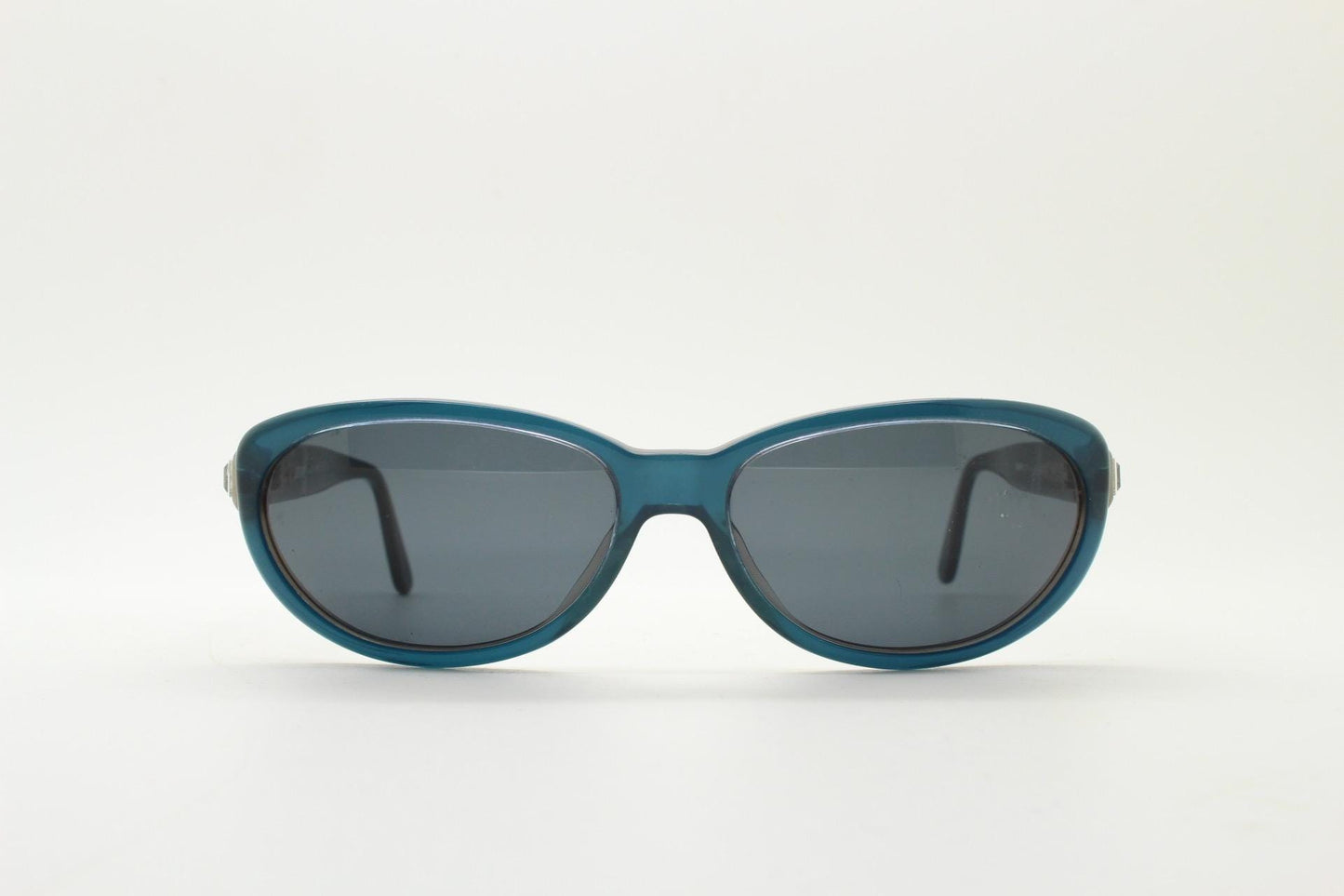Genny 90s vintage oval cat eye sunglasses made in Italy. Transparent deep blue acetate frame with matching lenses. Womens NOS cateye. BNWT