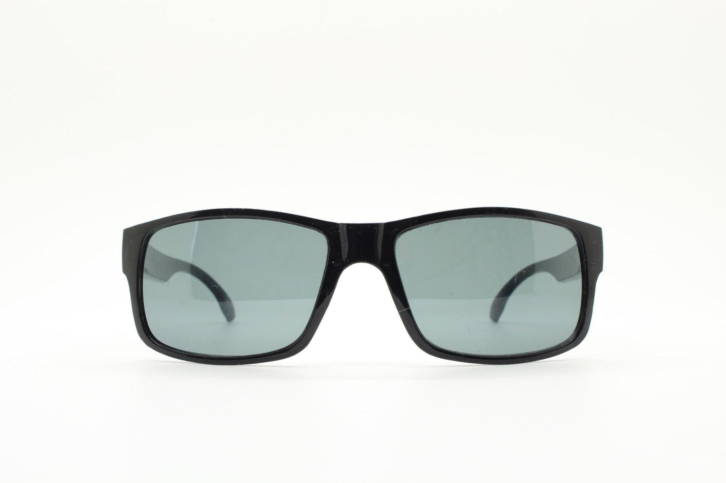 Y2K vintage sharp rectangular sunglasses. Large curved black gloss frame with dark green lenses and silver arrow arm crests. NOS