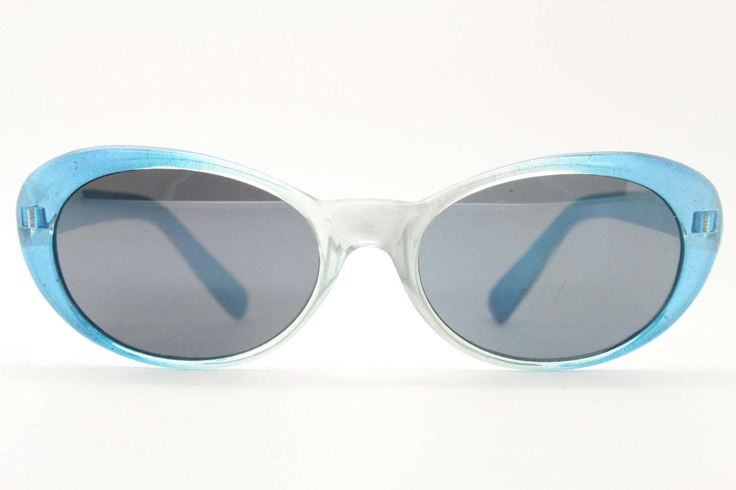 90s vintage oval cat eye sunglasses. Womens pearlised silver to aqua blue ombre fade cateye frame with contrasting dark lenses
