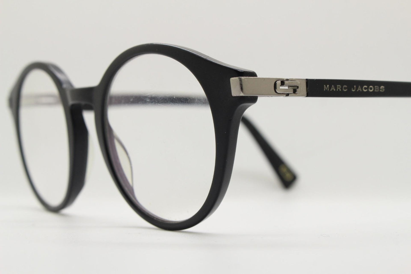 Marc Jacobs round eye glasses in plain black satin finish acetate. Strong fashion look optical frames. Prescription RX spectacles