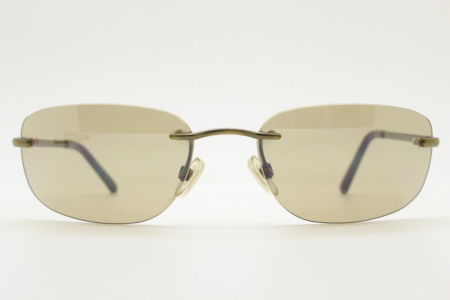 Ben Sherman 90s vintage frameless sunglasses. Minimal brown rectangular lens with brown chrome trim in neat proportions. Mens Mod shades