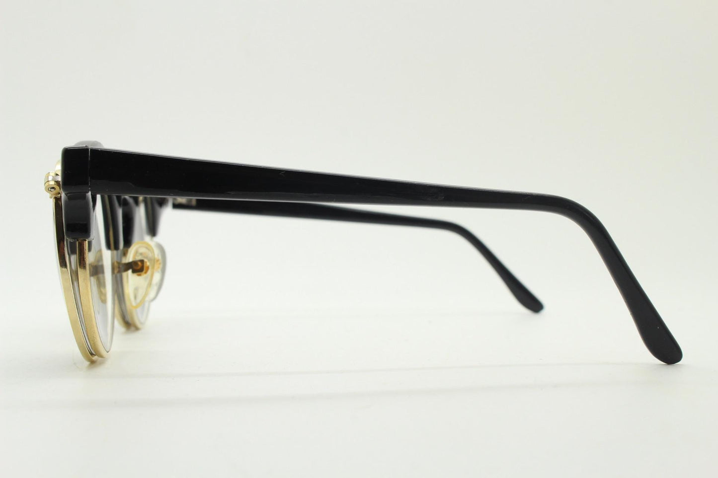 Vintage 80s round flipper sunglasses. Black gloss frame with clear lenses and incredible side flip up shades . BNWT unused NOS