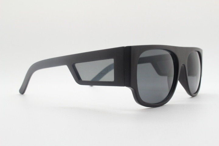 Y2K vintage rectangular side panel sunglasses. Black matt frame with grey lenses and side window spoilers / blinkers. 2000s NOS goggle