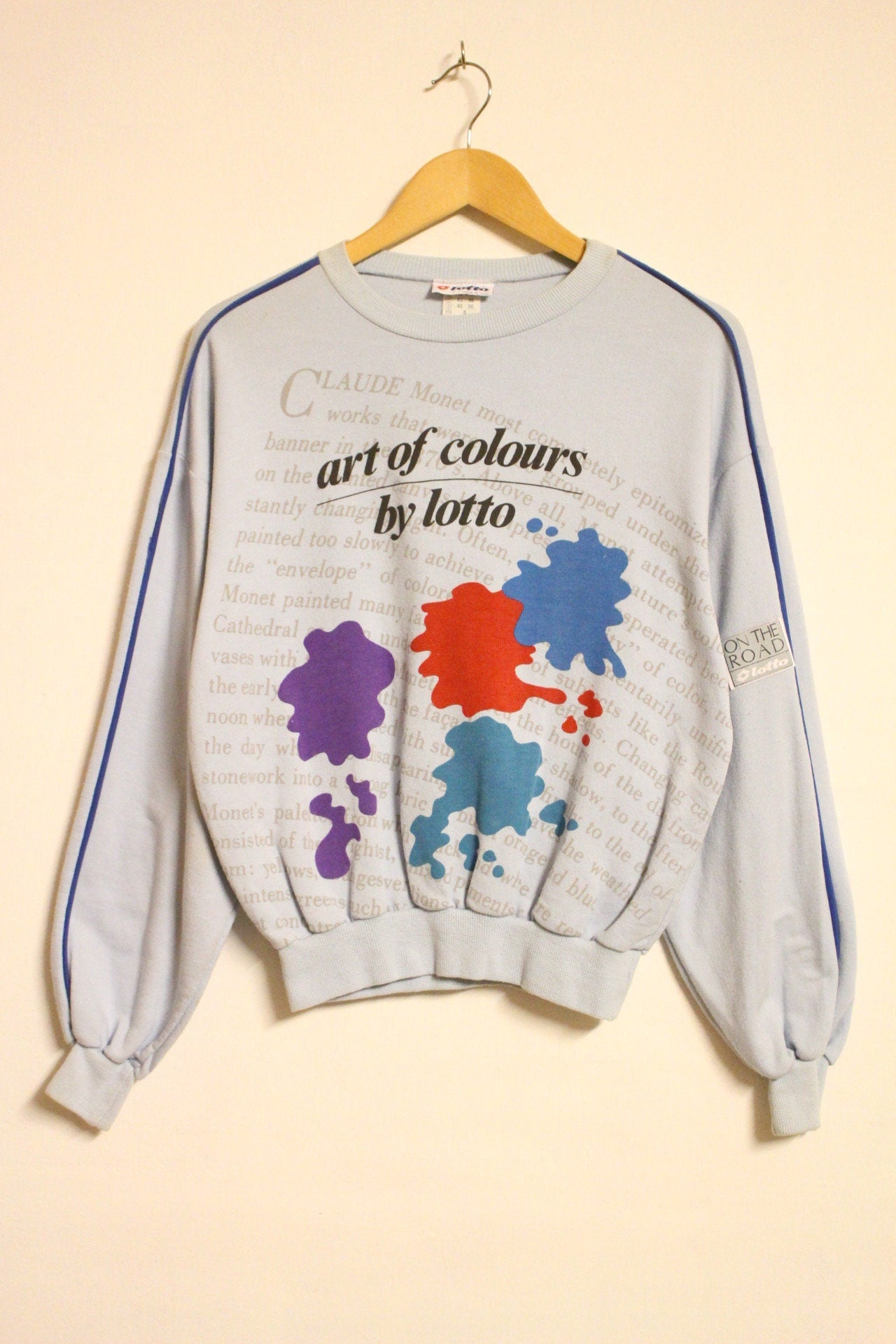 Vintage 80s blue sweatshirt by Lotto with 'art of colours' paint splash graphic. Made in Italy.