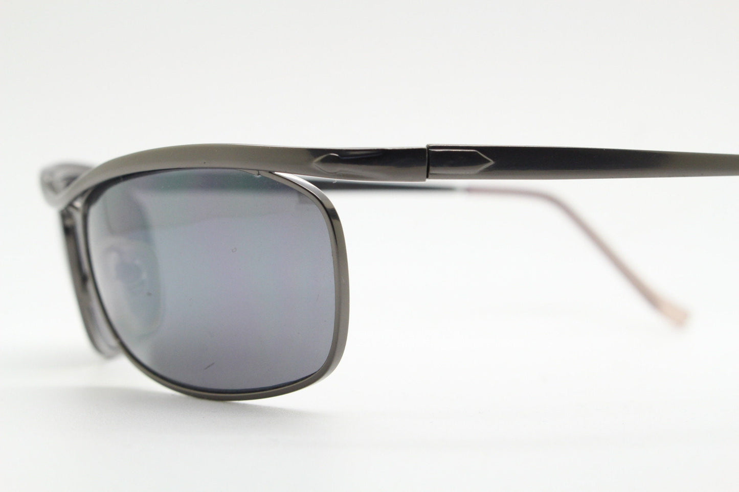Y2K vintage curved oval sunglasses. Minimal grey chrome metal aerodynamic sport shaped frame. 2000's. 00's NOS