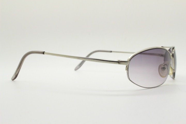 90s vintage modified extra small aviator sunglasses made in the USA. Satin finish solid metal frame aviators with light tone smoky lenses