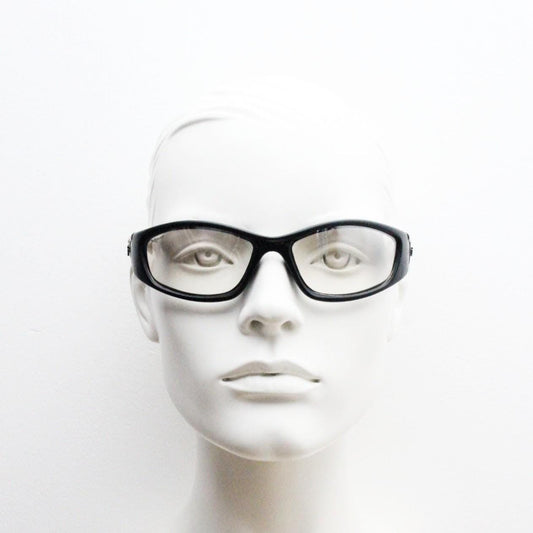 90s vintage sports sunglasses. Black matt aerodynamic wraparound with straight white rubber arms and light tone lenses. Y2K rave shield
