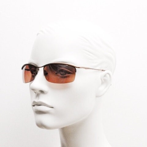 Y2K vintage curved rectangular sunglasses. Minimal half frame brow line design in brown satin finish with mid tone lenses. 2000's. 00's NOS