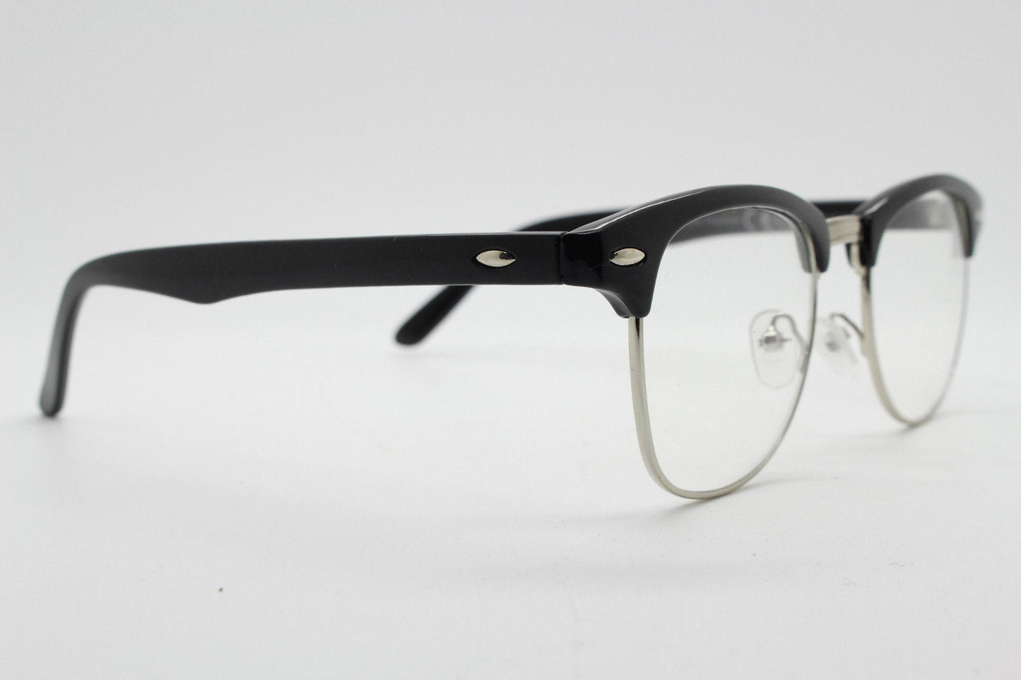 90s vintage black half frame eye glasses. Black gloss browline with silver wire rim frame and clear lenses. Classic 50s, 60s design. NOS