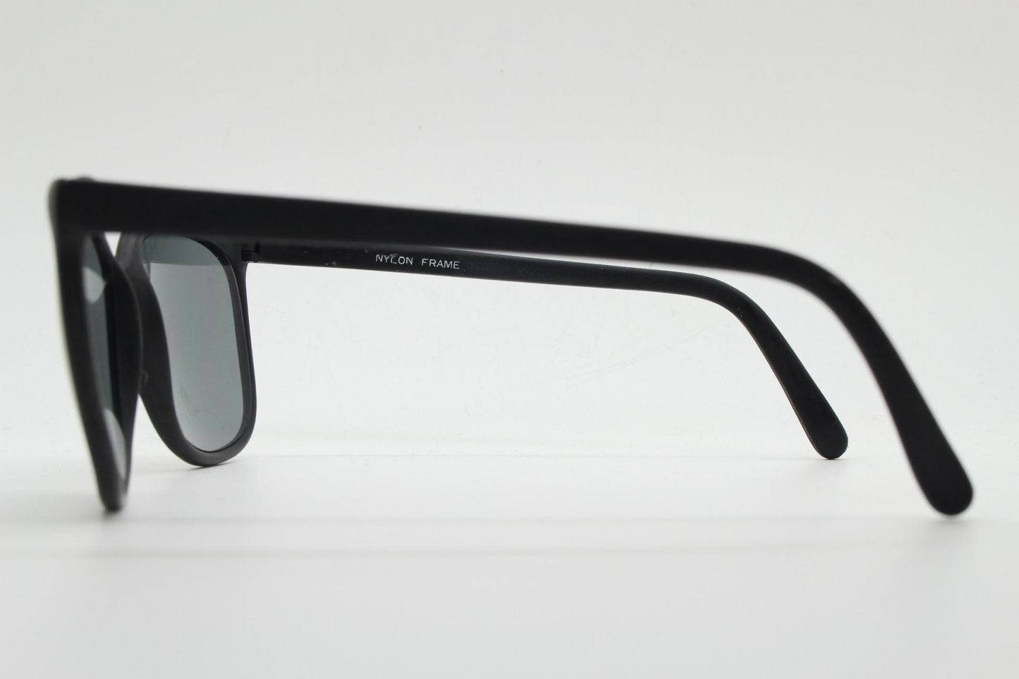 80s vintage flexible square sunglasses. Plain matt black frame with slight gold mirror glaze lens tone. Unused NOS. Rave