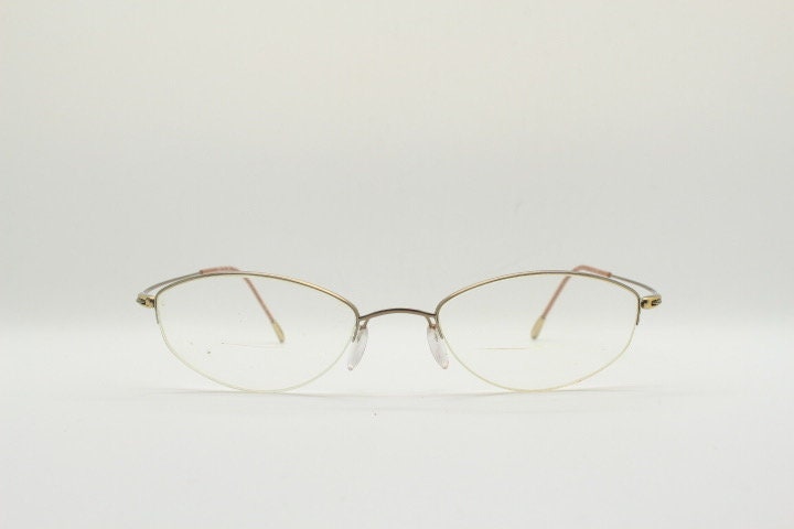 Silhouette oval half frame eye glasses model 6608 made in Austria. Minimal optical frame with extremely flexible wire arms. Prescription RX