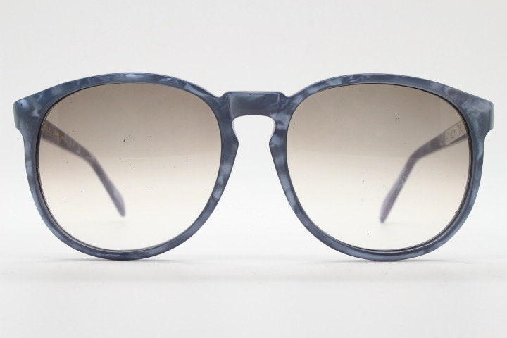 Michele L'Amy 80s vintage round sunglasses made in France. Lustrous marbled blue frame with keyhole bridge and graduating brown lenses