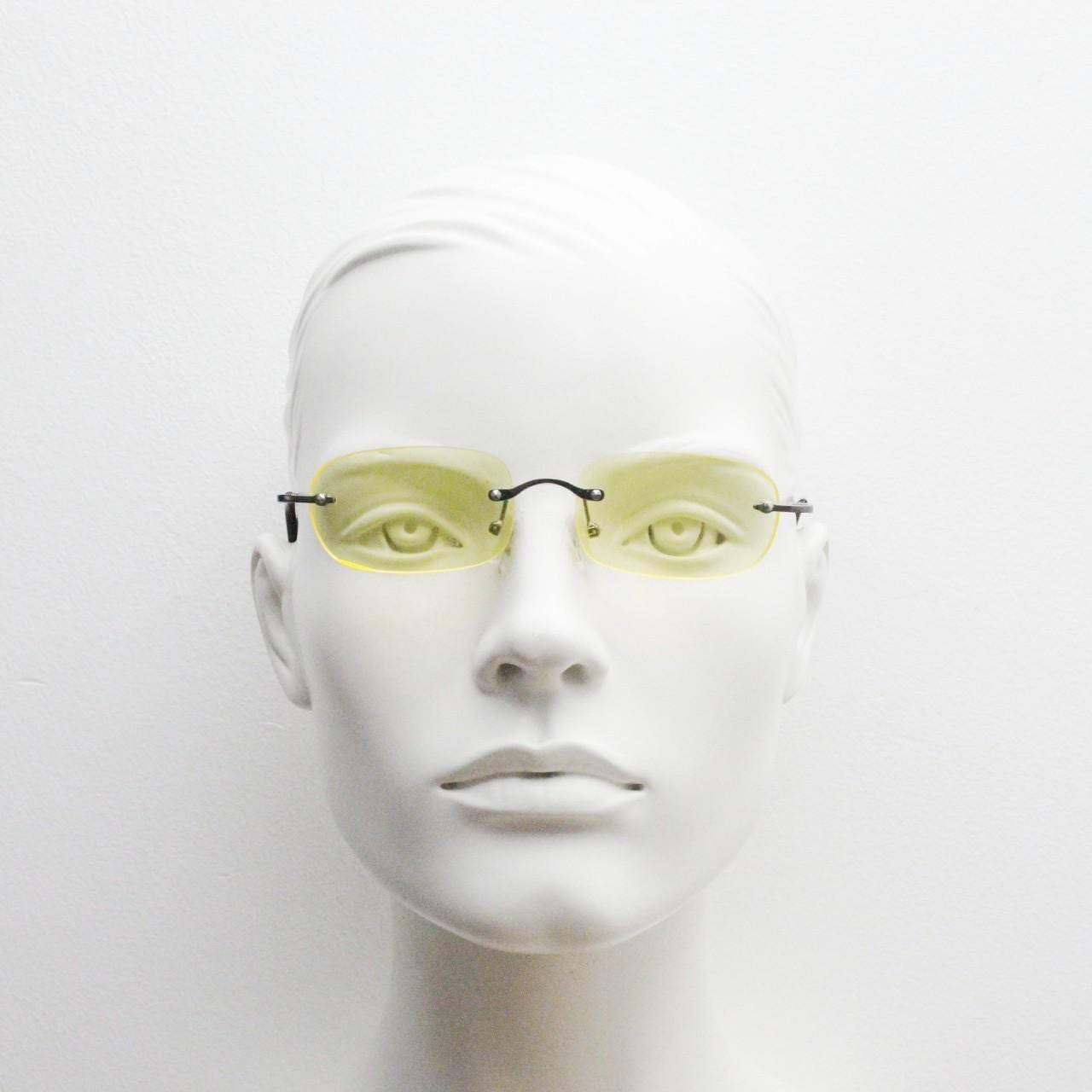 Y2K vintage frameless yellow sunglasses. Rectangular lenses with grey metal bridge and arms. 2000s club kids. 00's. 90s Rave
