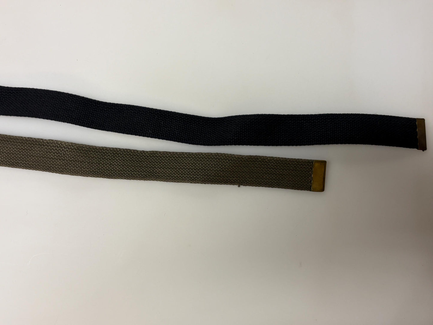 2 x bundle 80s vintage canvas army belts. One black plus one khaki green no holes format. Slide lock gold buckle. Webbing. Fully adjustable