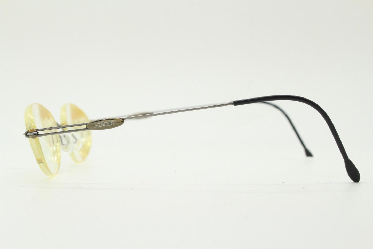 Silhouette vintage oval frameless eye glasses made in Austria. Minimal lightweight brown chrome optical frame. Prescription spectacles