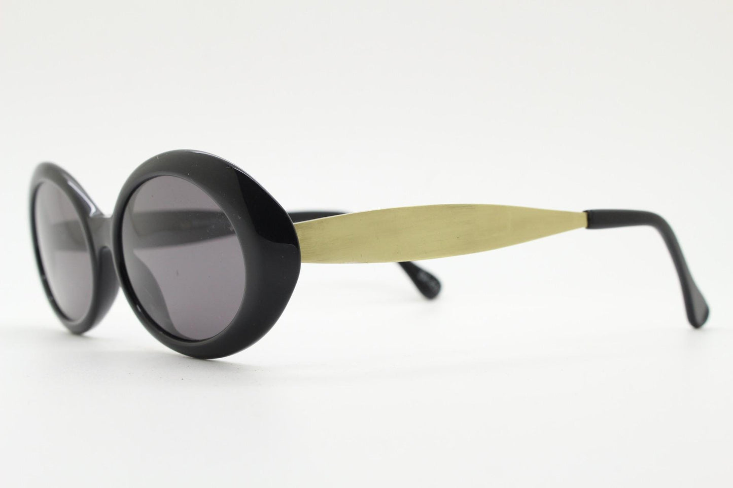 Benson and Ashley vintage 90s oval sunglasses model 406. Neat size quality 60s style acetate frame with tall flat gold arms. New Old Stock.