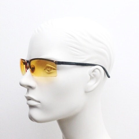 Y2K vintage half frame visor sunglasses. 2000's black brow line with light tone blazing orange rectangular curved lenses. 00's