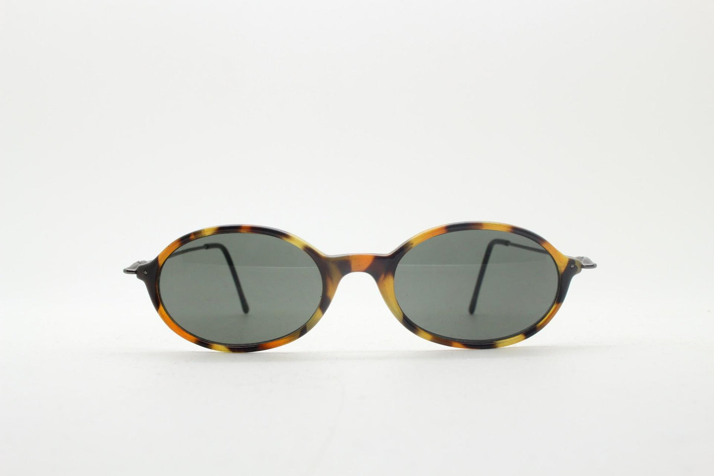 90s vintage oval sunglasses. Honey tortoise frame with refined slim 'industrial tech' style arms. Micro. Unused NOS