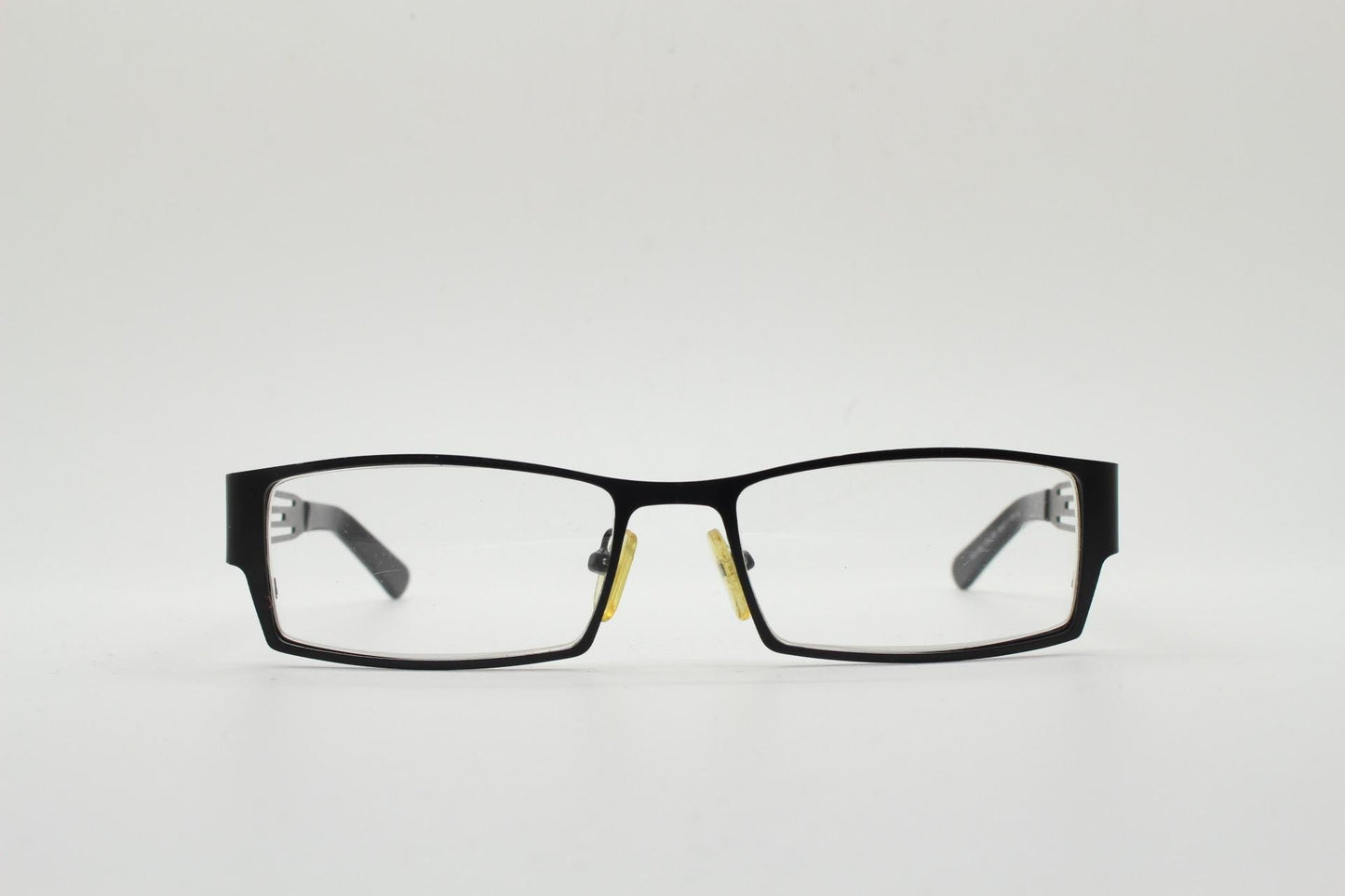 Police 90s vintage rectangular eye glasses model 023. Solid metal optical frame in black satin finish with cut out arm stripes. Prescription