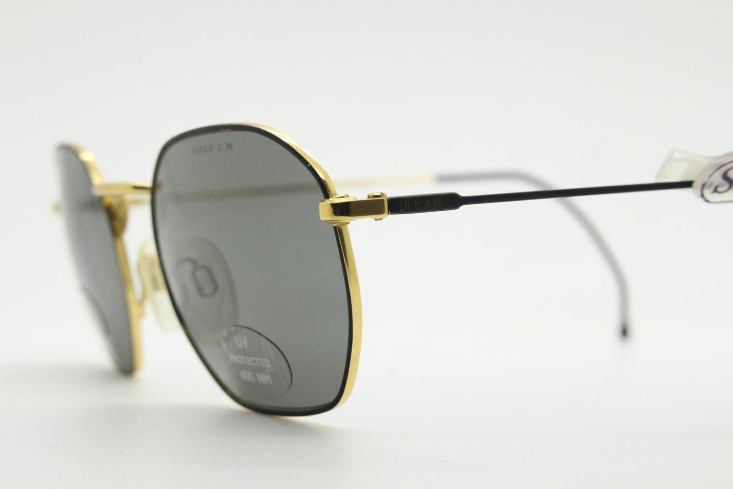 Safilo 90s vintage angled rectangular sunglasses made in Italy. Flexible black wire  metal frame with gold trim and green lenses. BNWT NOS