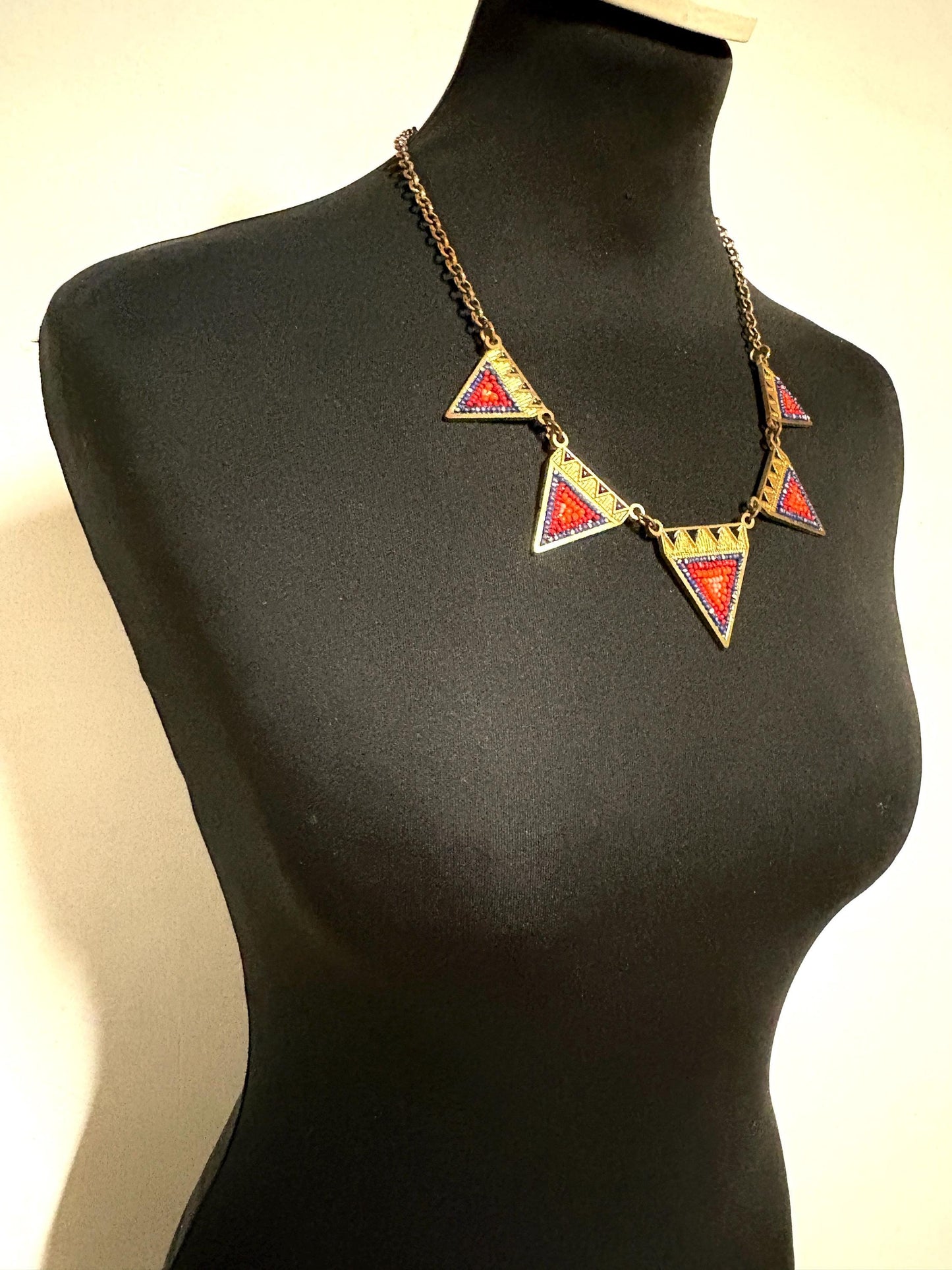 80s vintage gold triangles necklace. Aztec style with multi coloured bead inlays and ornate patterns. Womens statement design