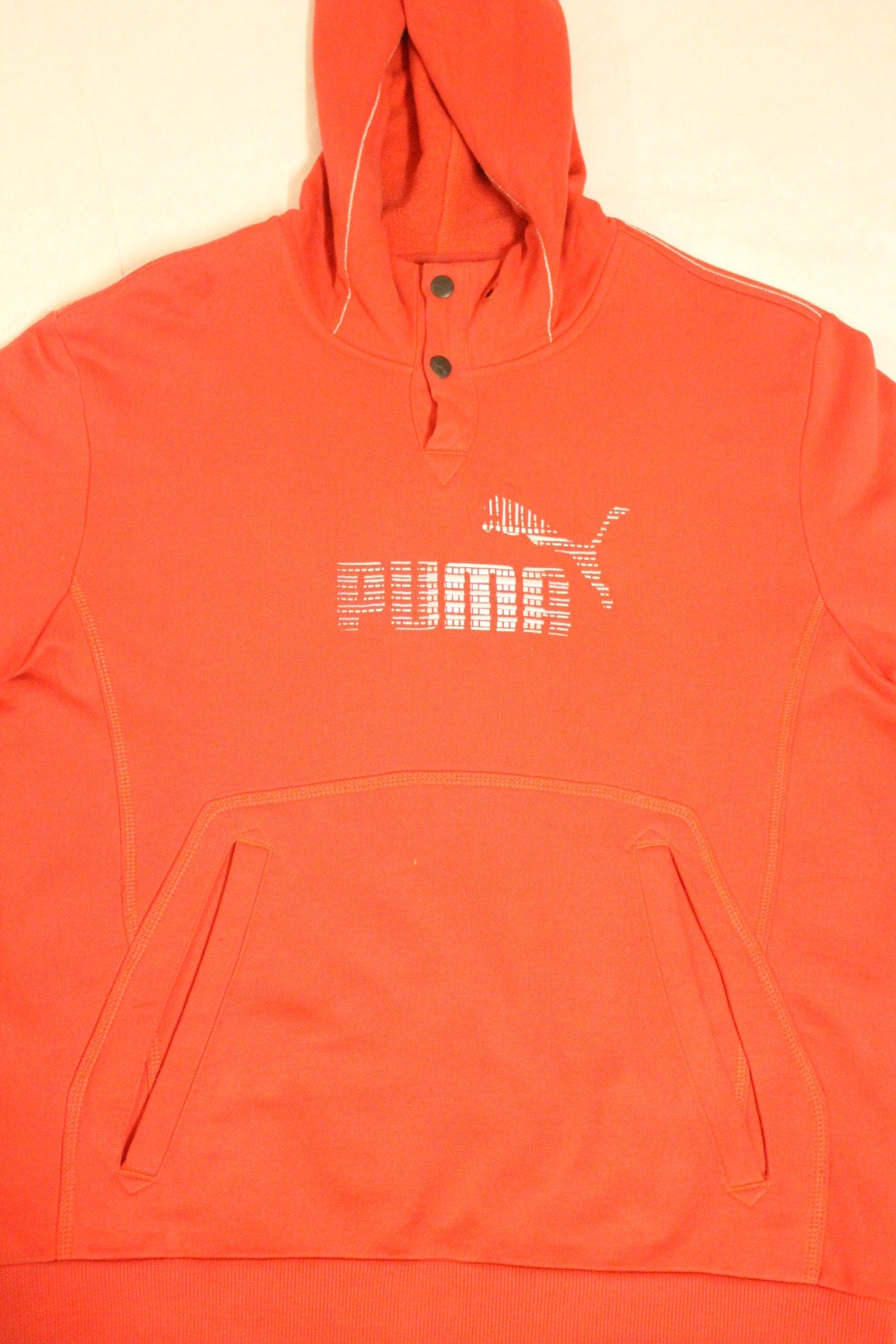 Puma red hoody with big chest logo. Unisex sports pullover sweatshirt with front muffler pockets. UK size L