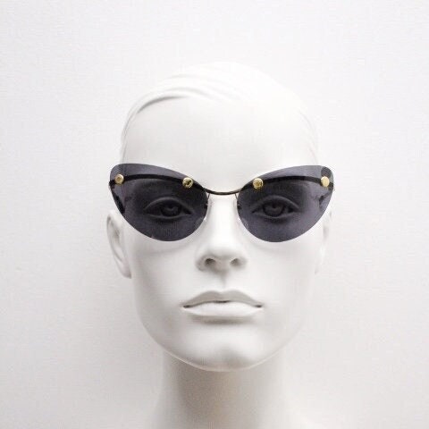 Moschino oval cat eye sunglasses model 082/S. Womens frameless cateye in perfect proportions with golden metal brow line