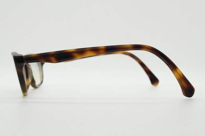 Calvin Klein Jeans modified cat eye glasses model CKJ918. Tortoise gloss low profile acetate optical frames. Prescription eyeglasses. RX