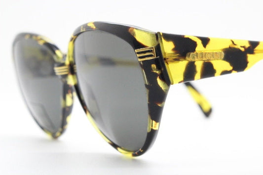 Gucci 90s vintage large oval sunglasses model 2135 made in Italy. Vibrant amber and mottled brown bug eye. NOS