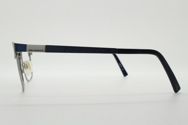 Karl Lagerfeld squared wayfarer shape eye glasses. Navy check pattern arms with satin finish brow optical frames. Prescription eyeglasses.