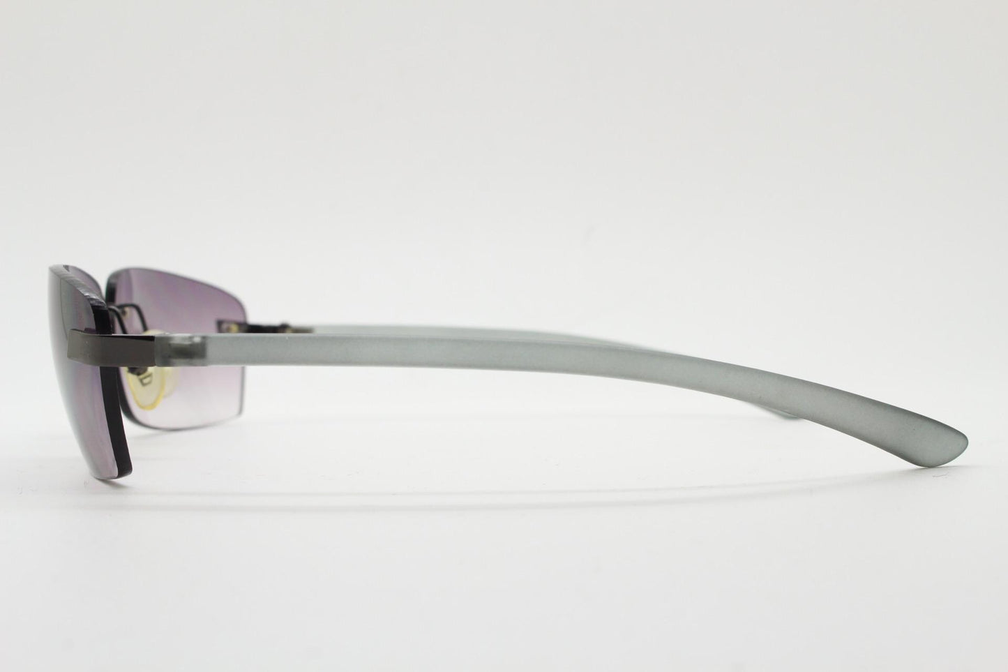 90s vintage minimal frameless sunglasses. Minimal mulberry rectangular lenses with gunmetal grey trim and frosted arms. Matrix shades
