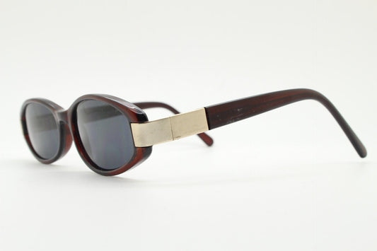 Vintage 90s oval cat eye sunglasses. Minimalistic small low profile brown fine quality acetate frame with gold corners. Womens NOS.
